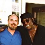 Photo of Lee with Clarence Clemons